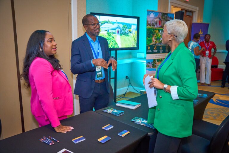 Exhibitors talking with attendees at a booth